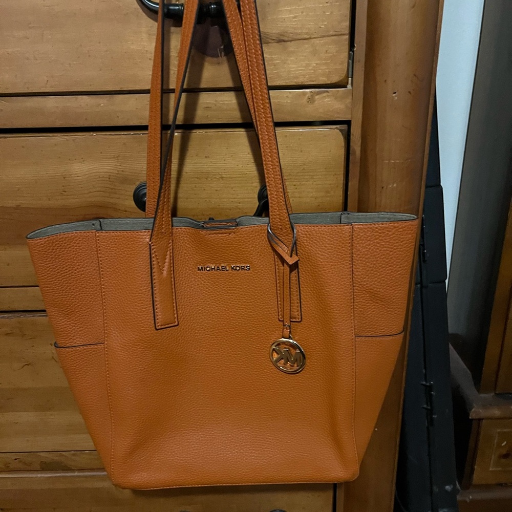 ***Sold***Michael Kors, used good condition,orange tote